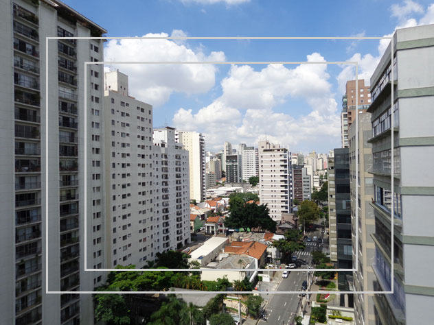 Paisagem urbana com marcação da área enquadrada por lentes de 28 mm, 31 mm e 38 mm